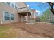 View of the home's backyard, showing the outdoor deck and stairs at 5720 Stow Dr, Tucker, GA 30084