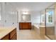 Luxurious bathroom featuring a large soaking tub, separate shower, and double vanity at 5720 Stow Dr, Tucker, GA 30084