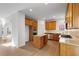 Kitchen with island and wood cabinets, stainless steel appliances, and granite countertops, perfect for cooking at 5720 Stow Dr, Tucker, GA 30084