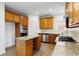 Bright kitchen featuring stainless steel appliances, a granite-topped island, and plenty of cabinet space at 5720 Stow Dr, Tucker, GA 30084