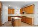 Spacious kitchen featuring granite countertops, ample wood cabinetry, and stainless steel appliances at 5720 Stow Dr, Tucker, GA 30084