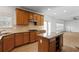 Open kitchen with stainless appliances, granite counters, and breakfast bar that is great for entertaining at 5720 Stow Dr, Tucker, GA 30084