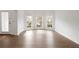 Bright living area with hardwood floors, white walls, and a bay window at 5720 Stow Dr, Tucker, GA 30084