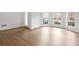 Bright living room featuring wood floors, white trim, and large windows for natural light at 5720 Stow Dr, Tucker, GA 30084