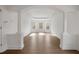 Elegant living room with decorative columns, tray ceiling, and abundant natural light, ideal for entertaining at 5720 Stow Dr, Tucker, GA 30084