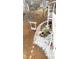 Backyard with a brick path, white gravel, porch swing, fire pit, and garden at 679 Victorian Cir, Dallas, GA 30157