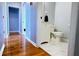 Hallway leading to an updated bathroom with modern fixtures at 679 Victorian Cir, Dallas, GA 30157