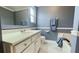 Bathroom with double vanity, soaking tub, and clean finishes at 679 Victorian Cir, Dallas, GA 30157