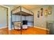 Bedroom featuring hardwood floors, bunk bed, and a chair at 679 Victorian Cir, Dallas, GA 30157