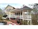 Charming home featuring a gazebo and a decorative pond with a waterfall feature at 679 Victorian Cir, Dallas, GA 30157