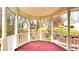 Gazebo with wood floor and white railings and posts overlooking a wooded area at 679 Victorian Cir, Dallas, GA 30157