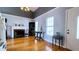 Living room with hardwood floors, fireplace, and neutral wall color at 679 Victorian Cir, Dallas, GA 30157