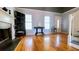 Living room with hardwood floors, fireplace, and dark furniture at 679 Victorian Cir, Dallas, GA 30157