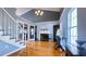 Living room with vaulted ceiling, hardwood floors, fireplace, and elegant chandelier at 679 Victorian Cir, Dallas, GA 30157