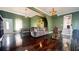 Spacious living room with dark wood floors and green walls at 679 Victorian Cir, Dallas, GA 30157