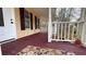 Covered porch featuring dark wood flooring, white railing and posts, and outdoor rug at 679 Victorian Cir, Dallas, GA 30157