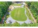 Aerial view of community park with playground, walking paths, and green spaces at 820 Thermopylae Ct, Alpharetta, GA 30005