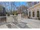 Lovely back deck with modern gray flooring and an outdoor dining set at 820 Thermopylae Ct, Alpharetta, GA 30005