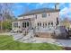 Spacious backyard featuring a stone patio and a large, well-maintained lawn at 820 Thermopylae Ct, Alpharetta, GA 30005