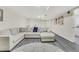 Finished basement with recessed lighting, vinyl floors, and sectional sofa at 820 Thermopylae Ct, Alpharetta, GA 30005