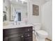 Well-lit bathroom featuring white countertops, dark cabinets, and vanity at 820 Thermopylae Ct, Alpharetta, GA 30005