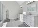 Bright bathroom featuring double vanities, tile floors, and a walk-in shower at 820 Thermopylae Ct, Alpharetta, GA 30005