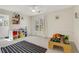 Spacious, naturally lit room with shelving and light colored walls at 820 Thermopylae Ct, Alpharetta, GA 30005
