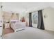 Bedroom bedroom featuring a crib, floral wallpaper, and large window at 820 Thermopylae Ct, Alpharetta, GA 30005