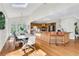 Bright dining room with view to the kitchen boasts large windows and a contemporary style at 820 Thermopylae Ct, Alpharetta, GA 30005