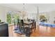 Open-concept dining room with hardwood floors, natural light and views of the Living Room at 820 Thermopylae Ct, Alpharetta, GA 30005