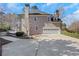 View of the home featuring an attached garage and a well-maintained driveway at 820 Thermopylae Ct, Alpharetta, GA 30005