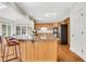 A kitchen featuring an island with counter seating and stainless steel appliances is displayed at 820 Thermopylae Ct, Alpharetta, GA 30005