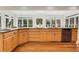 A Kitchen with hardwood floors, light cabinets and stainless steel appliances basks in sunlight at 820 Thermopylae Ct, Alpharetta, GA 30005