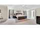 Spacious main bedroom featuring neutral tones, tray ceilings, and a cozy rug at 820 Thermopylae Ct, Alpharetta, GA 30005