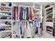 Spacious walk-in closet with custom shelving, racks, and storage solutions at 820 Thermopylae Ct, Alpharetta, GA 30005