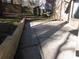 Outdoor patio area featuring concrete and a wooden retaining wall at 9165 Eves Cir, Roswell, GA 30076