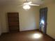 Bedroom with a bookshelf and a window with curtains, creating a cozy atmosphere at 9165 Eves Cir, Roswell, GA 30076