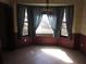 Charming dining area with a bay window, decorative wallpaper, and a hanging light fixture at 9165 Eves Cir, Roswell, GA 30076