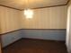 Traditional dining room with hardwood floors, decorative wallpaper, and elegant chandelier at 9165 Eves Cir, Roswell, GA 30076