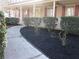 Landscaped front yard with lush greenery and a walkway leading to the front entrance at 9165 Eves Cir, Roswell, GA 30076