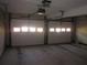 A two car garage with automatic opener and two white paneled garage doors at 9165 Eves Cir, Roswell, GA 30076
