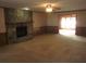 Large living room with a stone fireplace at 9165 Eves Cir, Roswell, GA 30076