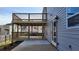 This gray home features a two-story deck and a concrete patio extending from the back of the home at 4271 Winston Cir, South Fulton, GA 30349