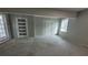 Unfinished basement featuring a smooth concrete floor, neutral paint, and two doors at 4271 Winston Cir, South Fulton, GA 30349