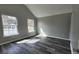 Neutral bedroom with two large windows and luxury vinyl plank flooring throughout at 4271 Winston Cir, South Fulton, GA 30349