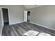 Bedroom with vaulted ceiling, neutral paint, and luxury vinyl plank flooring at 4271 Winston Cir, South Fulton, GA 30349