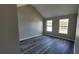 Bedroom featuring neutral paint, two windows, and luxury vinyl plank flooring at 4271 Winston Cir, South Fulton, GA 30349