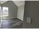 Vaulted bedroom features luxury vinyl plank flooring and a bright window at 4271 Winston Cir, South Fulton, GA 30349