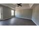 Spacious bedroom featuring hardwood floors, neutral paint, tray ceilings, and a ceiling fan at 4271 Winston Cir, South Fulton, GA 30349