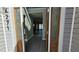 Open foyer with gray walls and wood-look flooring, seen through decorative glass doors at 4271 Winston Cir, South Fulton, GA 30349